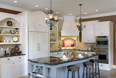a kitchen with a full range of appliances