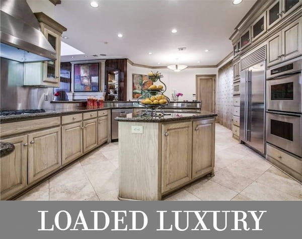 A Luxury Two-Story Mediterranean Home with Formal and Informal Living and a Full-Surround Kitchen