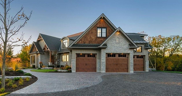 A Lovely Wood-Look Garage Door That Matches Shingle Accents on a Craftsman Home