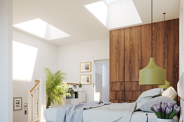 A Bedroom Brightened by Two Flat Roof Skylights