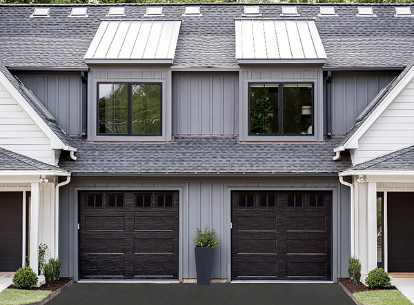 Chic Garage Doors with Recessed Panels on a Modern Farmhouse Design