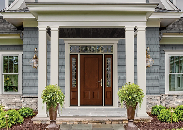 A Traditional Home with Decorative Glass All Around the Front Door