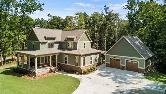 Custom Farmhouse with Wraparound Porch & Serious Curb Appeal