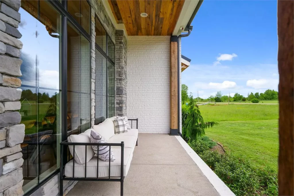 a front porch with a bench