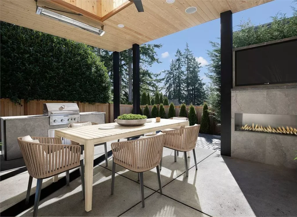 the outdoor dining area of a luxurious modern home