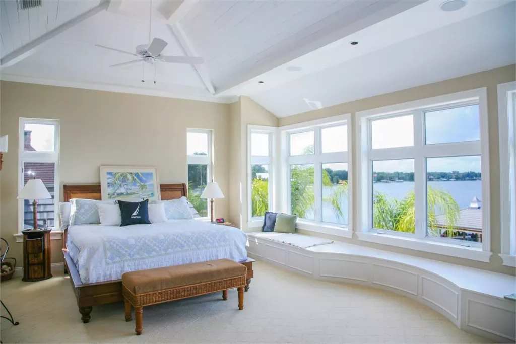 a Florida-style home with a second-story master suite that takes in lovely water views