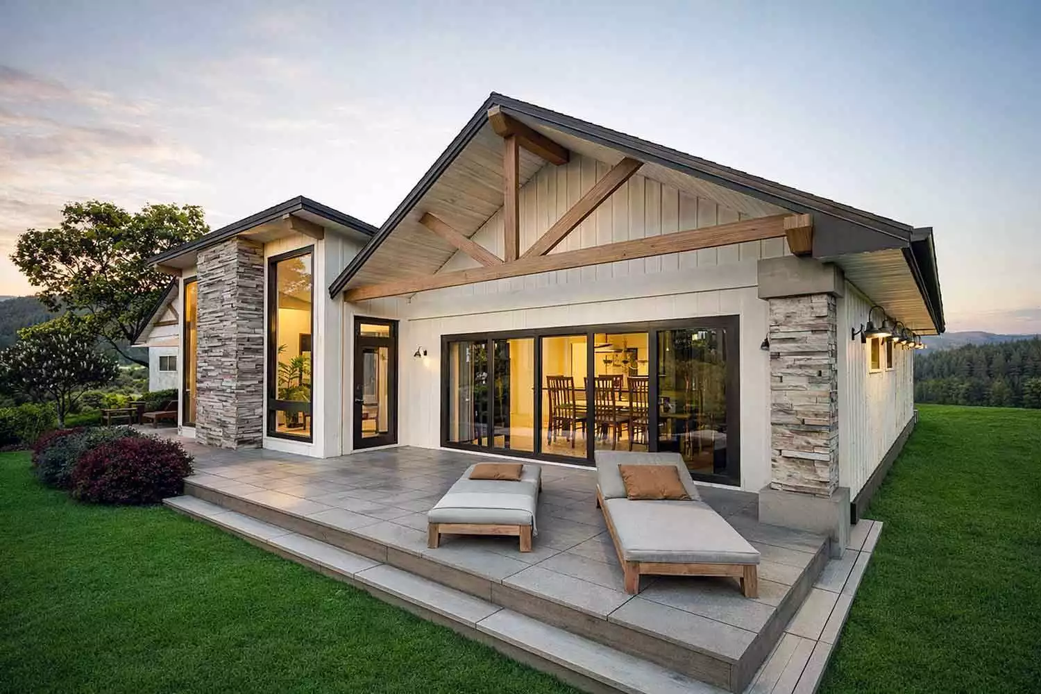 Rear elevation of House Plan 12489 featuring a covered outdoor living area with exposed timber trusses, stone columns, large sliding glass doors, and a spacious patio for entertaining and relaxation.