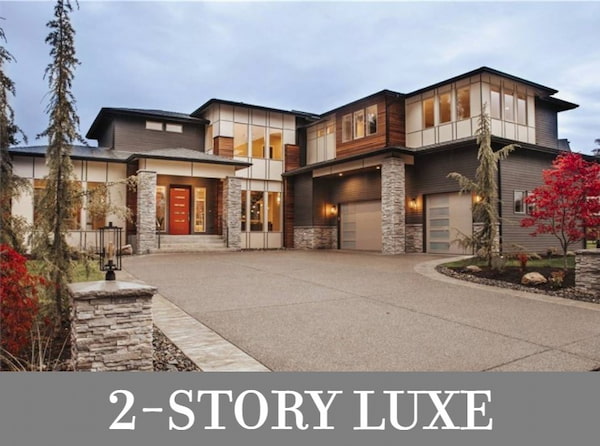 A Luxury Two-Story Home with Ample Windows, Open Living, a Sunny Den, Four Bedrooms, and a Bonus