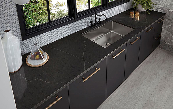 A Natural Stone-Look Black Quartz Countertop with Matte Black Cabinets Beneath