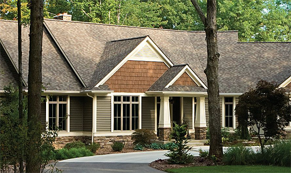 A Rustic Home in the Woods with Durable (& Recyclable!) Vinyl Siding Made to Withstand the Elements