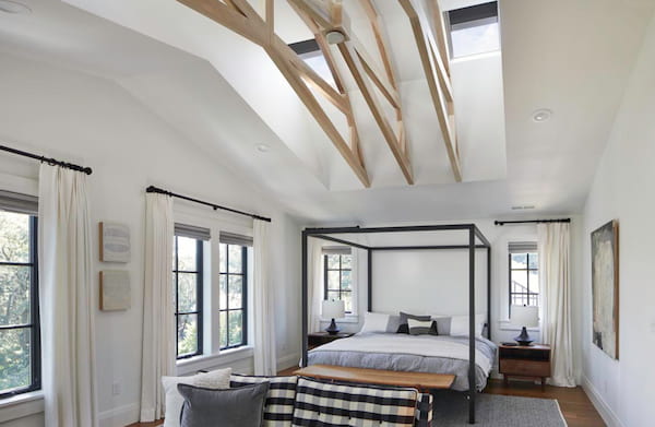 A Bright Bedroom with Skylights That Have Room-Darkening Shades