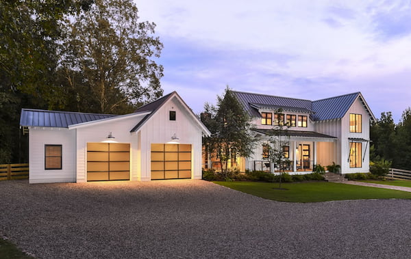 A Modern Farmhouse with a Garage with Glass Panel Doors