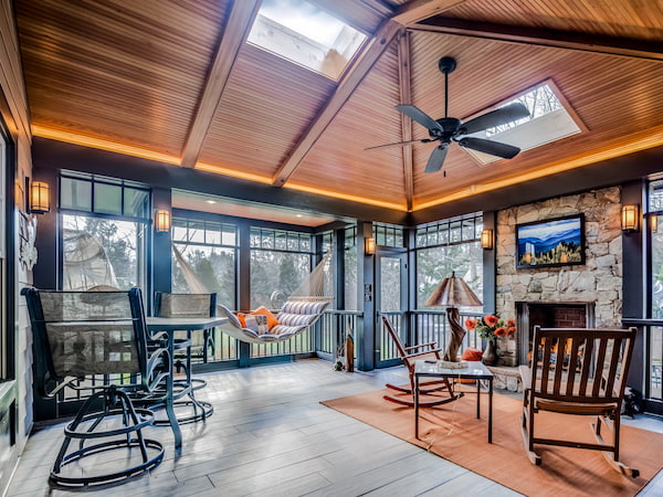 A Gorgeous Sunroom/Screened Porch with Skylights Overhead
