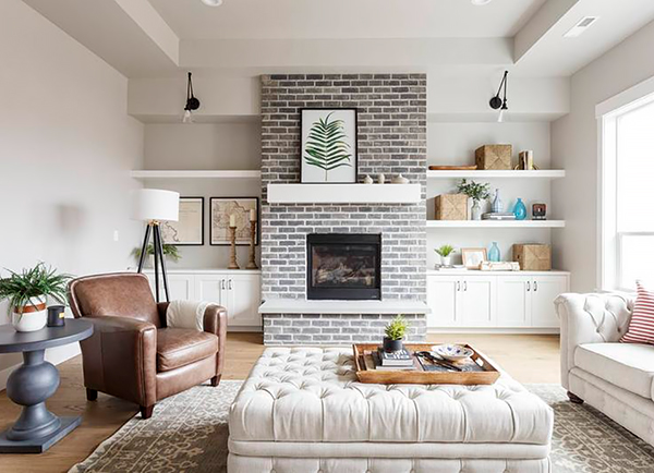 A Living Room with Grey Brick Around the Fireplace