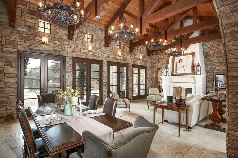 A Spacious Great Room with Rustic Stone Walls and Ceiling Trusses