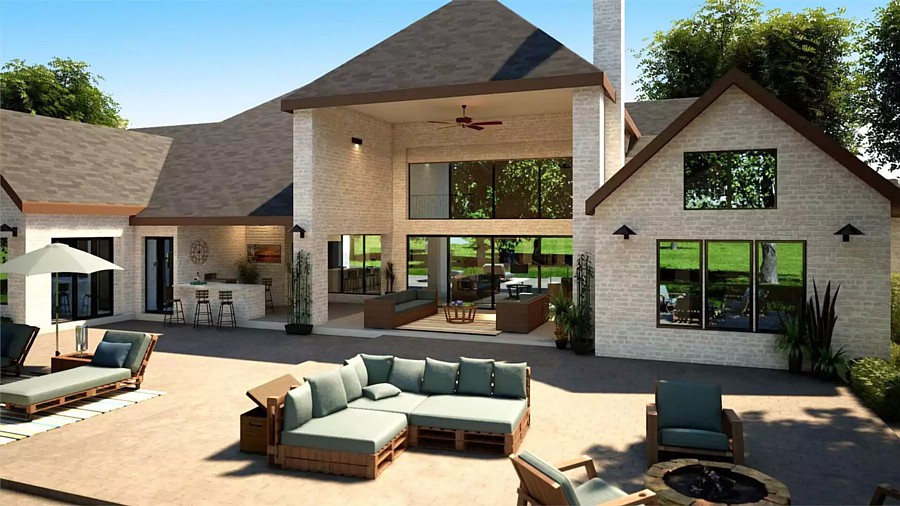 The Two-Story Outdoor Lounge Space with Kitchen/Bar in a Luxury Texas Home with 4,575 Square Feet