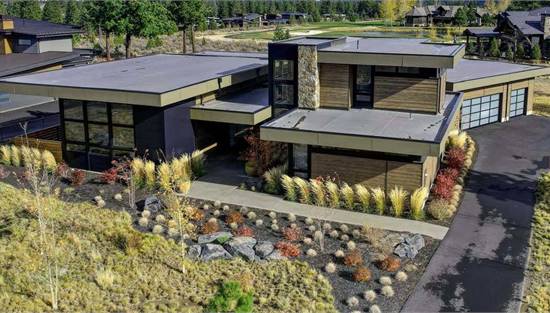 Two Story Contemporary Featuring Wood Siding & Flat Roofline