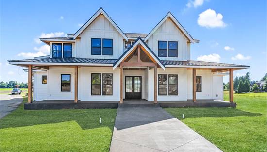 Beautiful Front View Featuring Metal Roof and Twin Gables