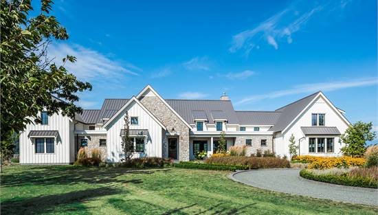 Modern Farmhouse with Mix of Stone and Board and Batten
